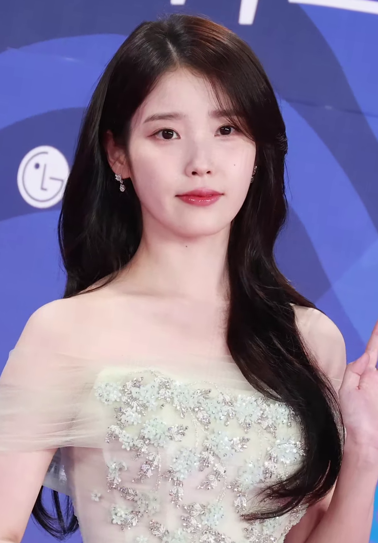 . IU (Lee Ji-eun) is a South Korean singer-songwriter and actress known for her hit songs like "Good Day" and "Blueming". 