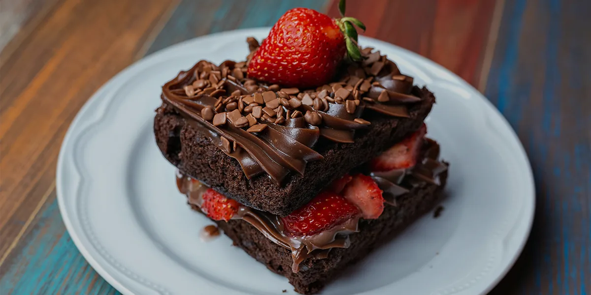 The plate of chocolate and strawberry represents that the chocolates really helps to boast the brain and make you learn faster and ace the exams