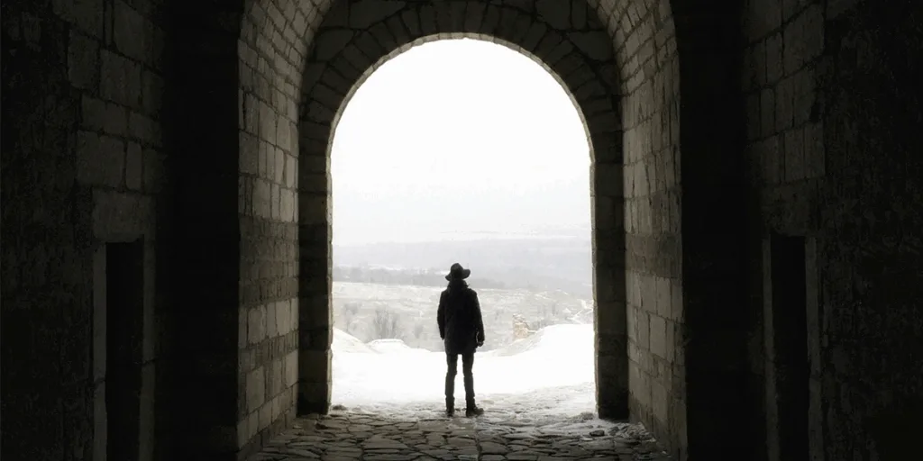 Traveler looking at horizon representing courage, belief in self, and new beginnings. When Life Feels Like a Dead End: Finding Another Path
