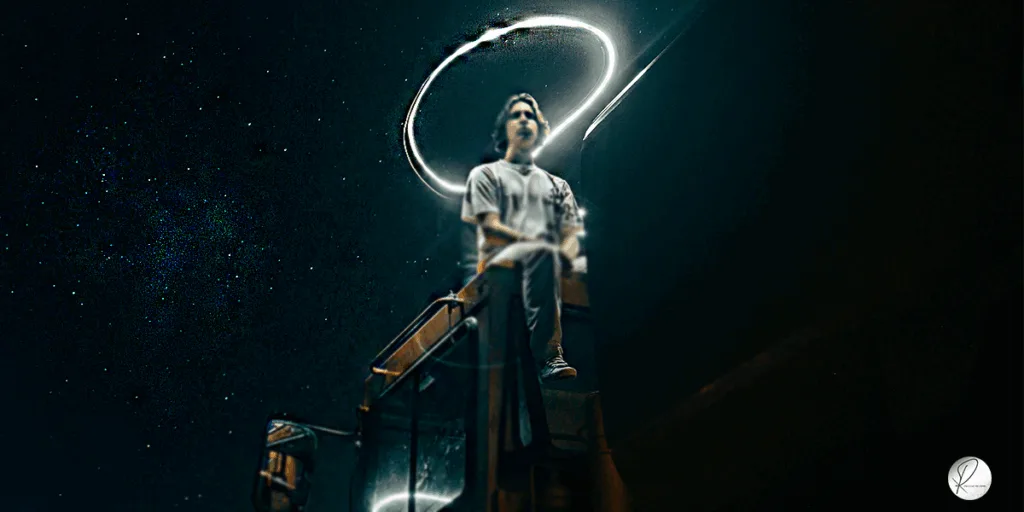 A young boy sitting on top of bus at the mid night having the light lines around his head