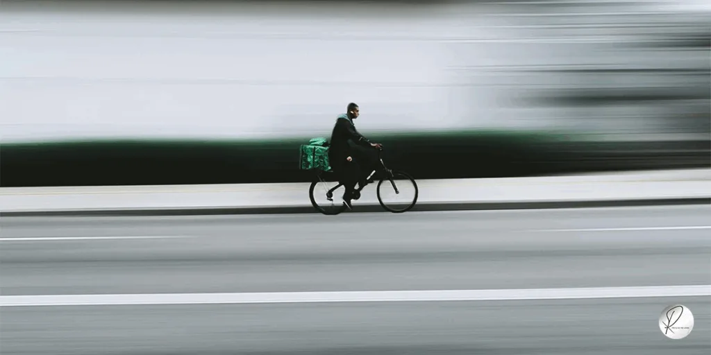 A man on bicycle, moving fast in pace of life and world showing Why Your Actions Matter Even Without Recognition